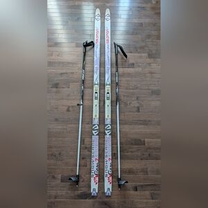 White and Gray Cross-Country Skis with Poles